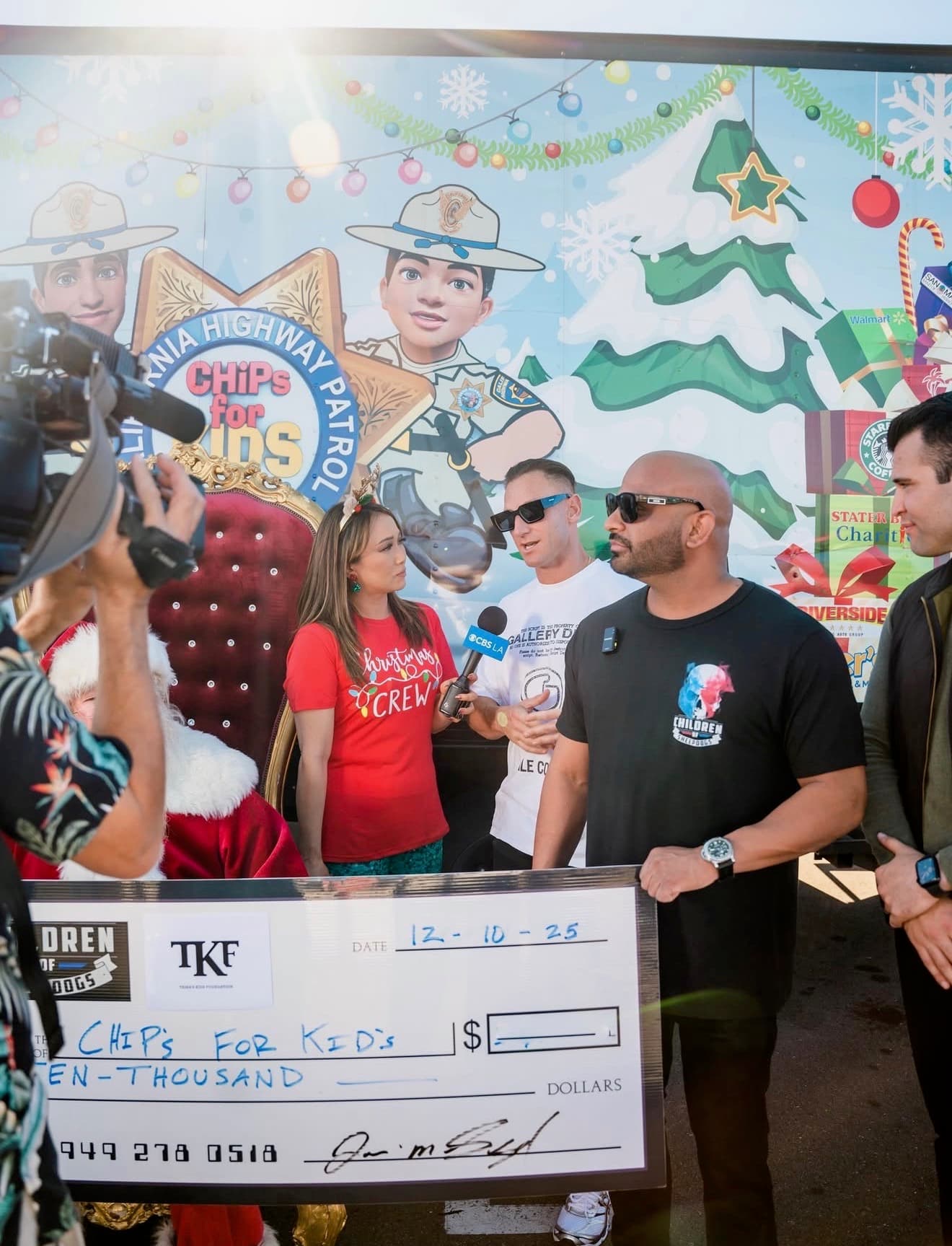 Trina's Kids Foundation presenting a donation to the CHP CHiPs for Kids holiday toy drive at a televised check presentation