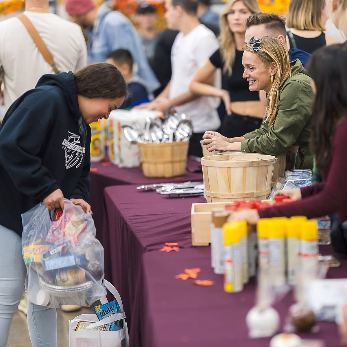 Volunteers helping families at a Trina's Kids Thanksgiving food distribution