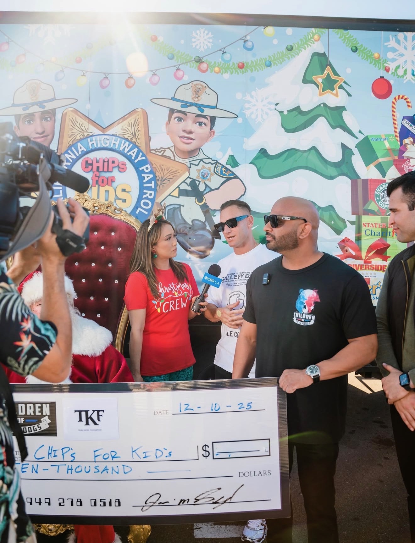 Trina's Kids Foundation presenting a donation to the CHP CHiPs for Kids holiday toy drive at a televised check presentation